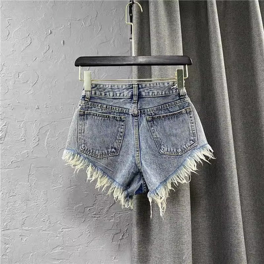 Women ripped denim shorts with fringe